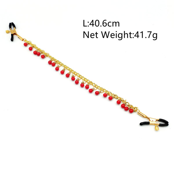 Pinces à tétons avec chaîne en or