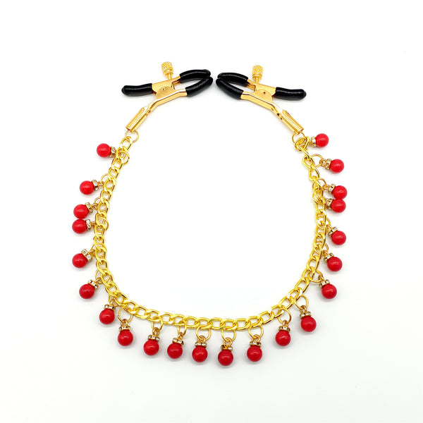 Pinces à tétons avec chaîne en or