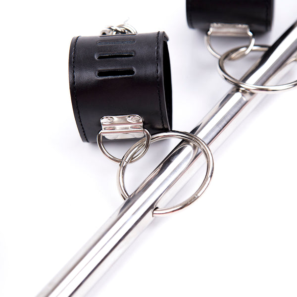 Barre d'écartement verrouillable pour poignets et chevilles